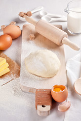 Dough preparation recipe for bread, pizza, pasta, cookies or pie ingridients, food flat lay on kitchen table background. Working with butter, milk, yeast, flour, eggs, sugar pastry or bakery cooking.