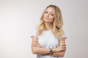 cherming blonde posing to the camera. youth, teenager and health concept. copy space