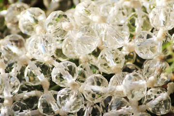 Fototapeta premium Sparkling beads on the green