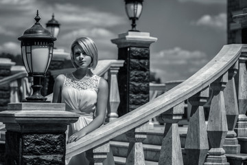 Portrait of a beautiful young woman outdoors. Black and white photo