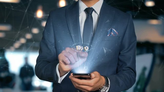 Businessman With Mobile Phone Opens Hologram HUD Interface and Touches Iso Curreny Code of Bahrain Dinar - BHD