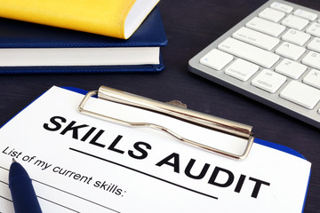 Skills audit form and pan on a desk.