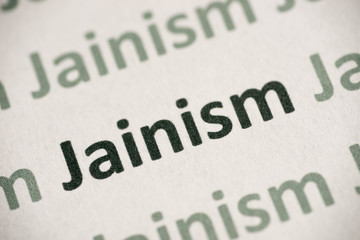 word  Jainism printed on paper macro