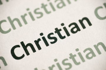 word Christian  printed on paper macro