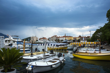 Fototapeta na wymiar Boat parking at sea bay before rain storm
