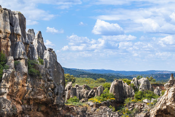 View to big beautiful mountains covered with greenery in sunny and cloudy day in Cerro del Hierro, Seviile