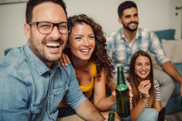 Group of friends having fun at home and enjoying together
