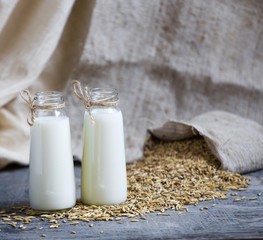 Oatmeal in bottles and oats in a bag