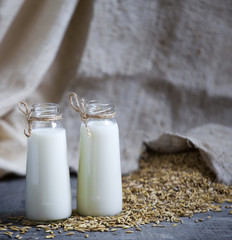 Oatmeal in bottles and oats in a bag