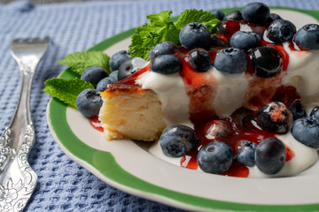 cheesecake with blueberry jam and sour cream