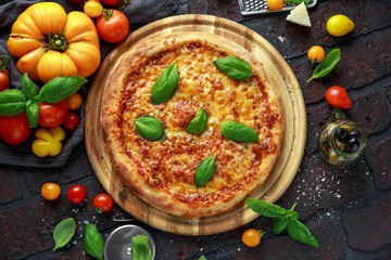 Stone Baked Pizza margherita with farm tomatoes sauce, parmesan and mozzarella cheese, basil