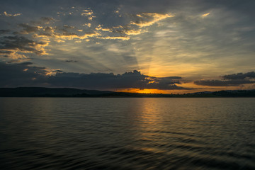 Obraz na płótnie Canvas Orange Sunset over the lake