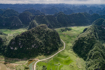 Aerial view of Karst mountains and rice fields