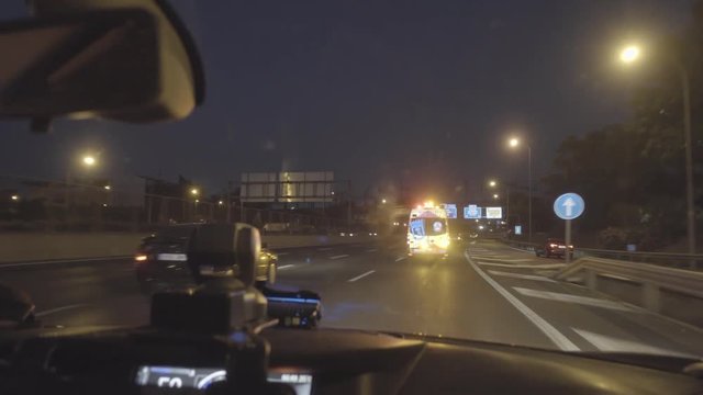 Interior Image Of Police Car Behind Ambulance