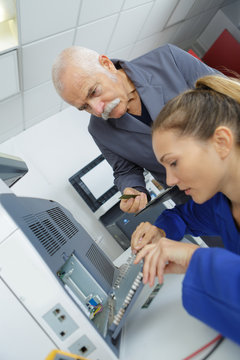 Computer It Support Worker Fixing Machine In Office