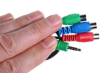 Engineer keeps his fingers audio video mass production cables with color coded connectors.