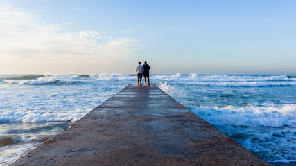 Father Son Fishing Beach Jetty Ocean Rear Photo Landscape