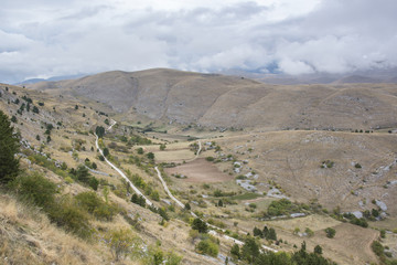 Fototapeta na wymiar slope of the hill with roads and fields