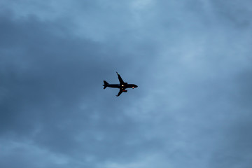 Airplane flying in the evening