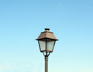 Fototapeta na wymiar Street lamp on blue sky