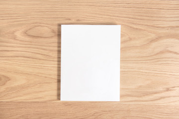 White empty blank cover book on wooden background.