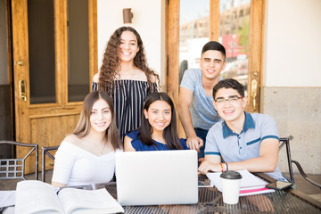 Group of students hanging out at cafe