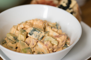 Close-up: plate with seafood salad and white mayonnaise sauce. 