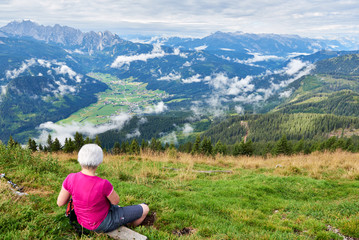 Fototapeta na wymiar Successful woman traveler, Enjoying Nature on top of mountain concept adventure active vacations outdoor hiking sport