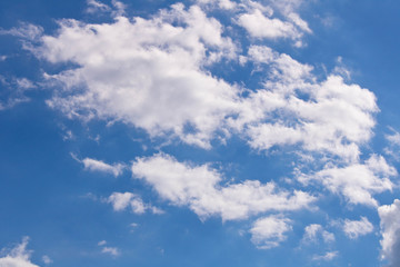 White fluffy clouds against a blue sky