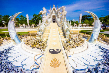 Beautiful view of the white temple Wat Rong Khun temple in Chiang Rai, Thailand in Asia - obrazy, fototapety, plakaty