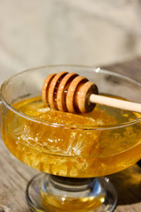 Fototapeta na wymiar A jar of honey on the table.