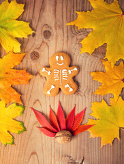 Gingerbread man skeleton on a pumpkin background. Halloween food concept.