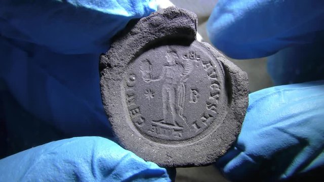 The impression on clay made by ancient seal