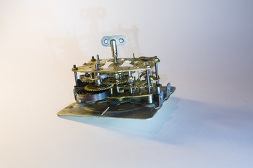  Disassembled mechanical clock, cogs and gears. 