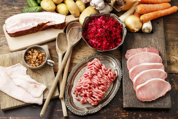 Raw pork and beef ground meat and vegetables.