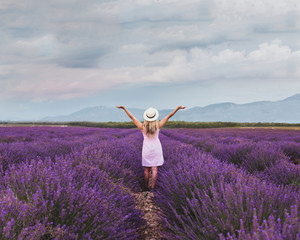 inspiration and creativity concept, woman in inspiring landscape of lavender fields in France