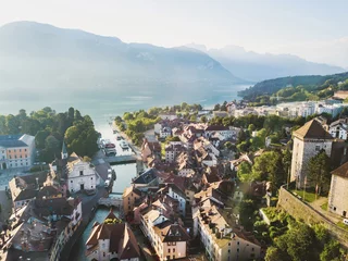 Annecy castle and old city aerial panoramic drone view, France