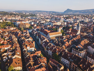 Obraz premium aerial panoramic view of Annecy city and Thiou river, France, historical landmark architecture of old town center, beautiful cityscape