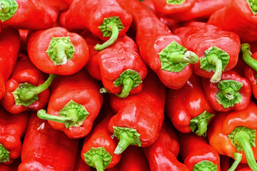 Red bell peppers background close up