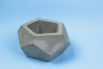 concrete pot for plants ,empty ,polygonal shape,bright background