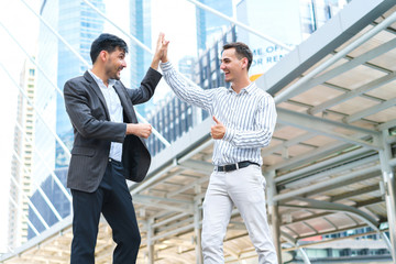 Two businessman happy, Asia Middle East and Europe success for contact at outdoors. concept of business successful dealing.