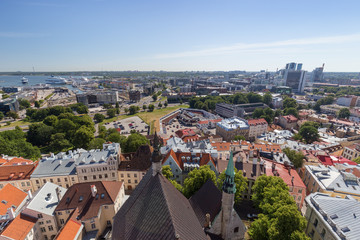 Fototapeta na wymiar Old buildings at the Old Town, harbor and downtown in Tallinn, Estonia, viewed from above on a sunny day in the summer.