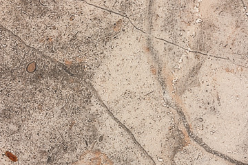 Surface of stoneware close up full of out of focus, granular shapes. A unique abstract background like the surface of an unknown planet.
