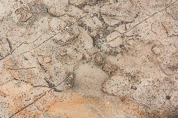 Surface of stoneware close up full of out of focus, granular shapes. A unique abstract background like the surface of an unknown planet.