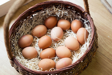 Fresh rooster eggs in the basket in organic store