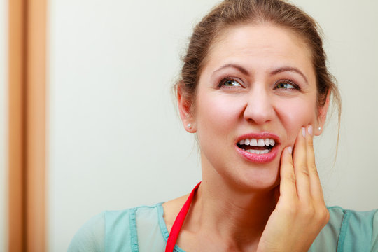 Woman suffering from toothache tooth pain.