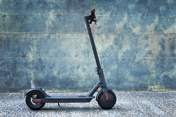 Electric scooter, blue abstract background 
