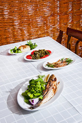 Blue fish and Armenian appetizer tahini topik, sea fennel and dried mackerel