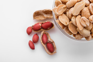 fresh peanuts on a white acrylic background