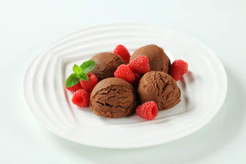 Fototapeta na wymiar Chocolate ice cream with fresh raspberries